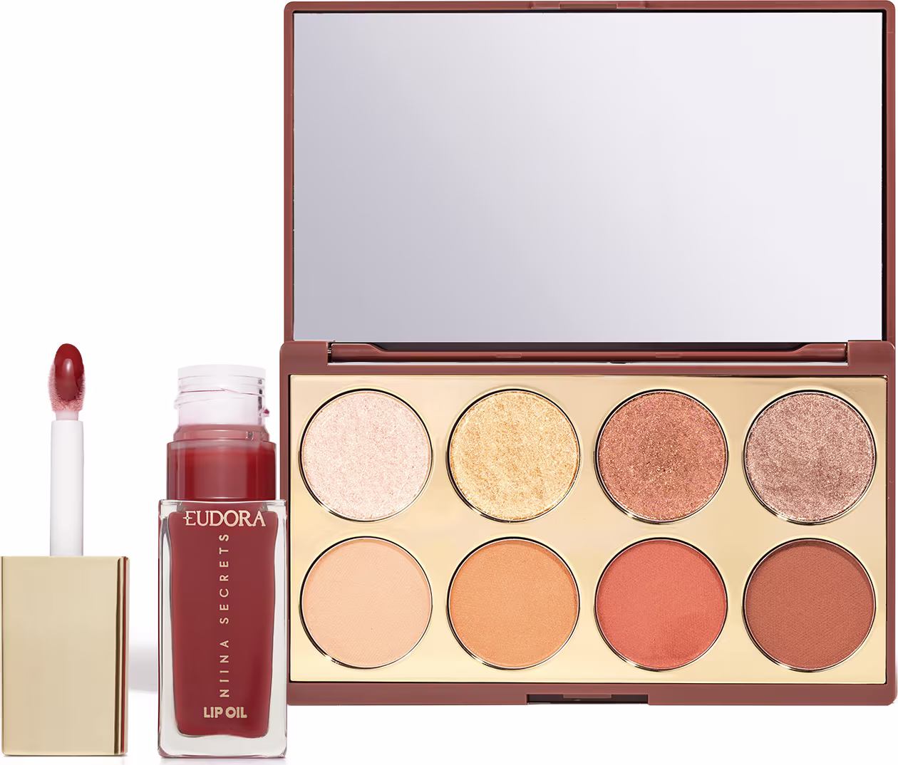 Paleta de sombras e batom da marca Niina Secrets, em embalagem com espelho e tons de marrom, bege e laranja. Produtos de maquiagem em frascos e caixas com rótulos visíveis.