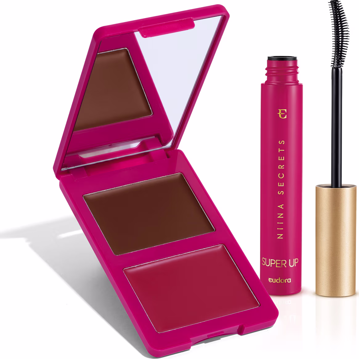 Compacto de maquiagem rosa com espelho, contendo sombra marrom e blush vermelho. Ao lado, um tubo de rímel preto da marca Niina Secrets.