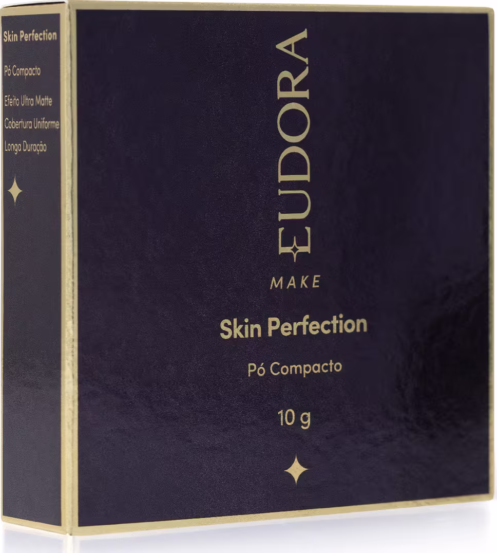 Caixa preta e dourada de pó compacto da marca Eudora Make, com texto "Skin Perfection" e informações sobre o produto.
