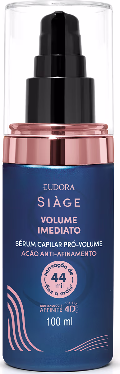 Frasco de sérum capilar pro-volume da marca Eudora Siage, com 100 ml de capacidade. Embalagem em tom azul escuro com detalhes em rosa dourado, contendo informações sobre o produto.
