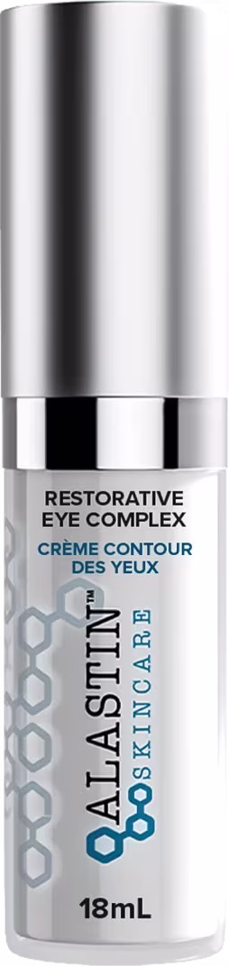 Sérum para a área dos olhos de Alastin. Embalagem cilíndrica de metal prateado. Rótulo na parte inferior com o texto "Restorative Eye Complex" e "Crème Contour des Yeux" em letras pretas sobre fundo branco.
