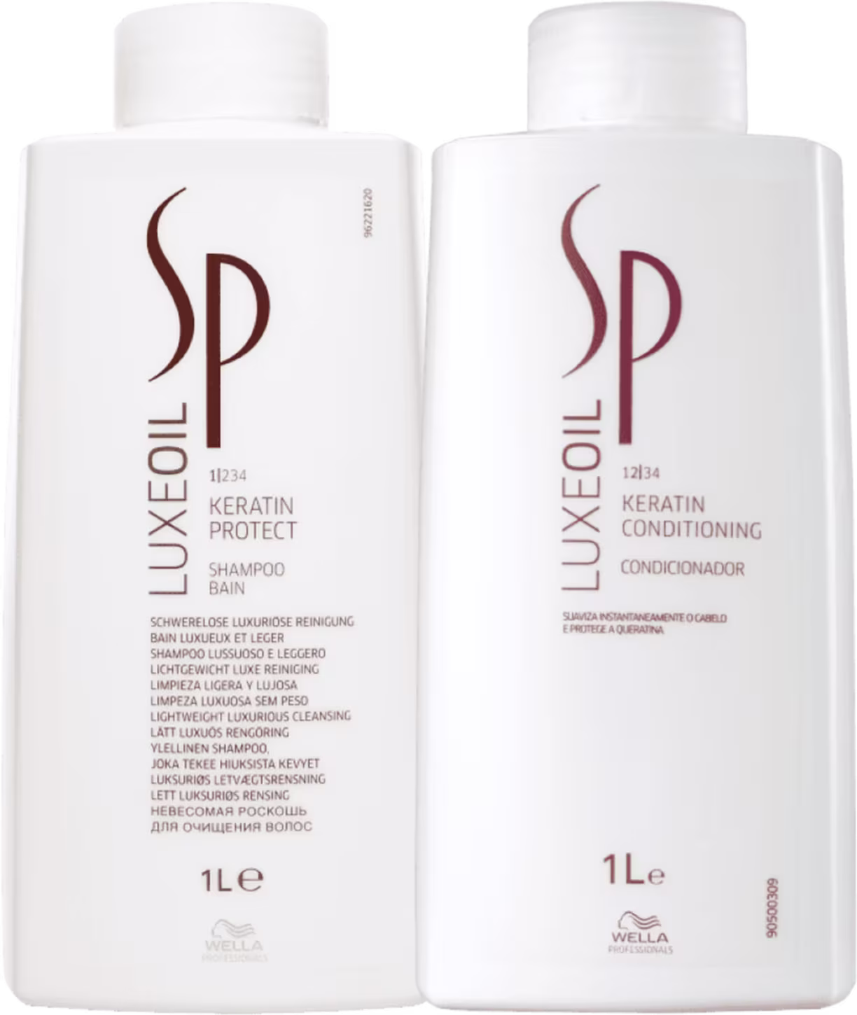 Dois frascos plásticos brancos de 1 litro cada, contendo shampoo e condicionador da linha Keratin da marca SP System Professional. Os frascos têm formato cilíndrico e tampas brancas.