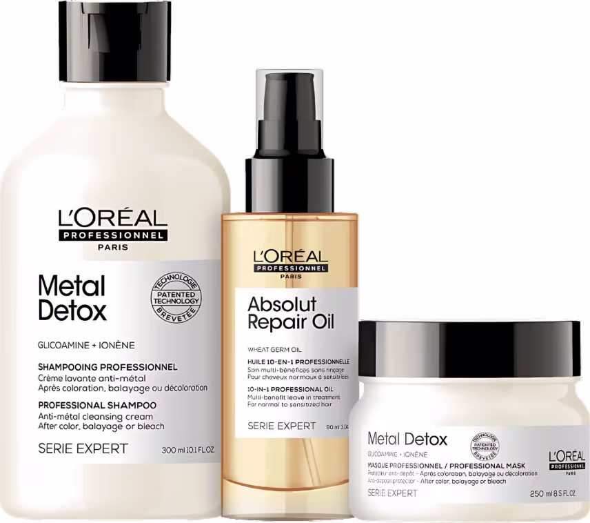 Conjunto de produtos L'Oréal Professionnel: shampoo Metal Detox, óleo reparador Absolut Repair Oil e máscara Metal Detox em embalagens brancas e pretas com detalhes em dourado.