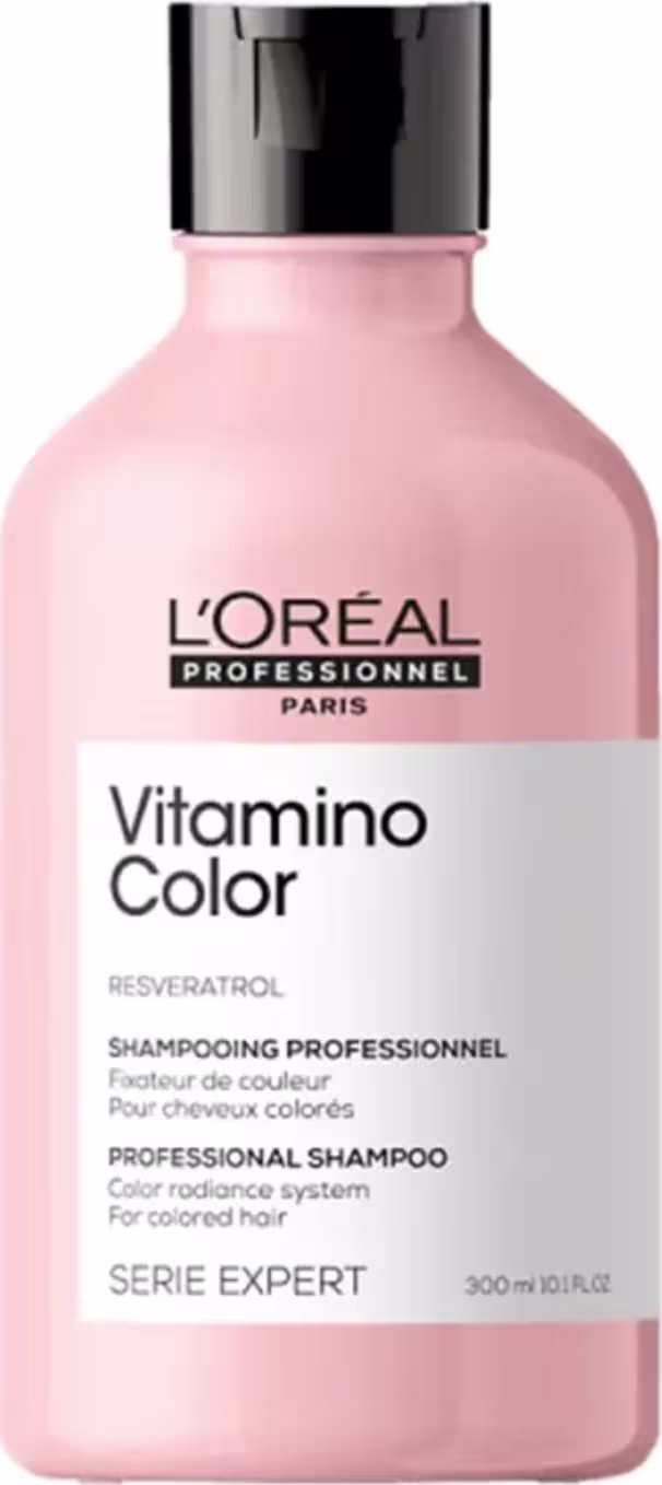 É um shampoo profissional da linha Serie Expert da L'Oréal Professionnel. A embalagem é uma garrafa plástica rosa claro com tampa preta.