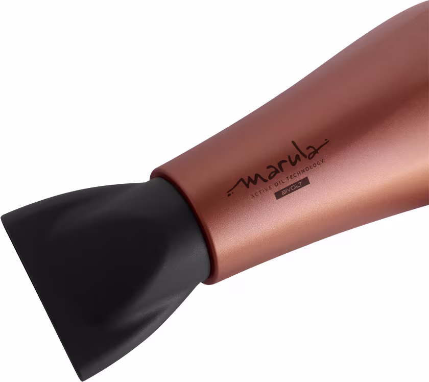 A imagem mostra o bico do secador de cabelo GA.MA Italy. O produto tem um corpo cilíndrico de metal em uma cor bronze metálica. Na lateral está impresso o logotipo "Marula" em letras minúsculas pretas. A ponta do secador é preta e arredondada.