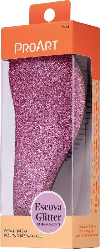 A imagem mostra uma embalagem plástica transparente contendo uma escova de cabelo com cerdas pretas e corpo brilhante em tom rosa. A embalagem é laranja com o logotipo "ProArt" e a descrição "Escova Glitter" em português.