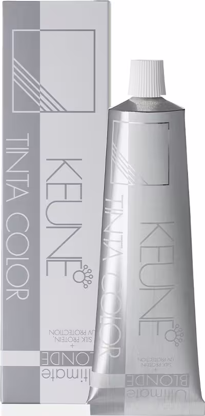 Produto de coloração capilar Keune Tinta Color. Embalagem composta por um tubo metálico prateado contendo o produto e uma caixa externa de papelão na cor cinza.