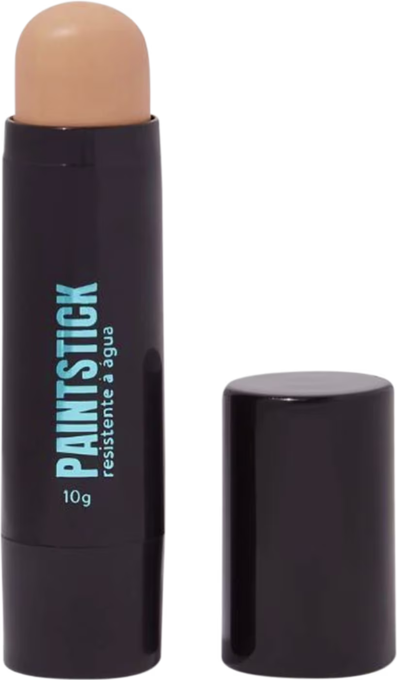 Bastão de maquiagem resistente à água da marca Catharine Hill, com embalagem preta e rótulo azul destacando o nome do produto. O item possui formato cilíndrico e tampa preta, com dimensões aproximadas de 10g.