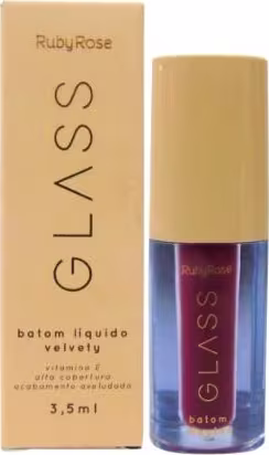 Batom líquido Ruby Rose. A embalagem consiste em um frasco de vidro com uma tampa. O rótulo exibe o nome da marca "Ruby Rose" e a descrição do produto "batom líquido velvety". A cor predominante do batom é um tom vinho.