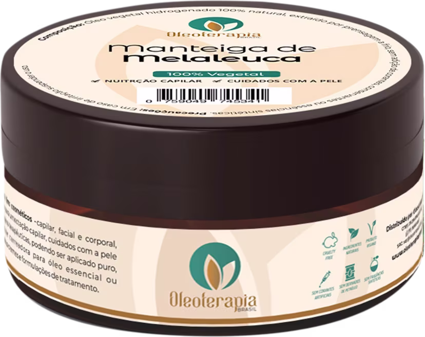O produto apresentado é um pote de manteiga de melaleuca da marca Oleoterapia Brasil. A embalagem possui uma cor predominantemente bege, com detalhes em verde, transmitindo uma aparência natural e orgânica.