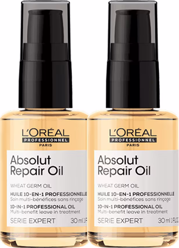 A imagem mostra dois frascos de óleo reparador Absolut Repair Oil da linha Serie Expert da L'Oréal Professionnel. Os frascos são de plástico laranja brilhante com tampas pretas de bomba.