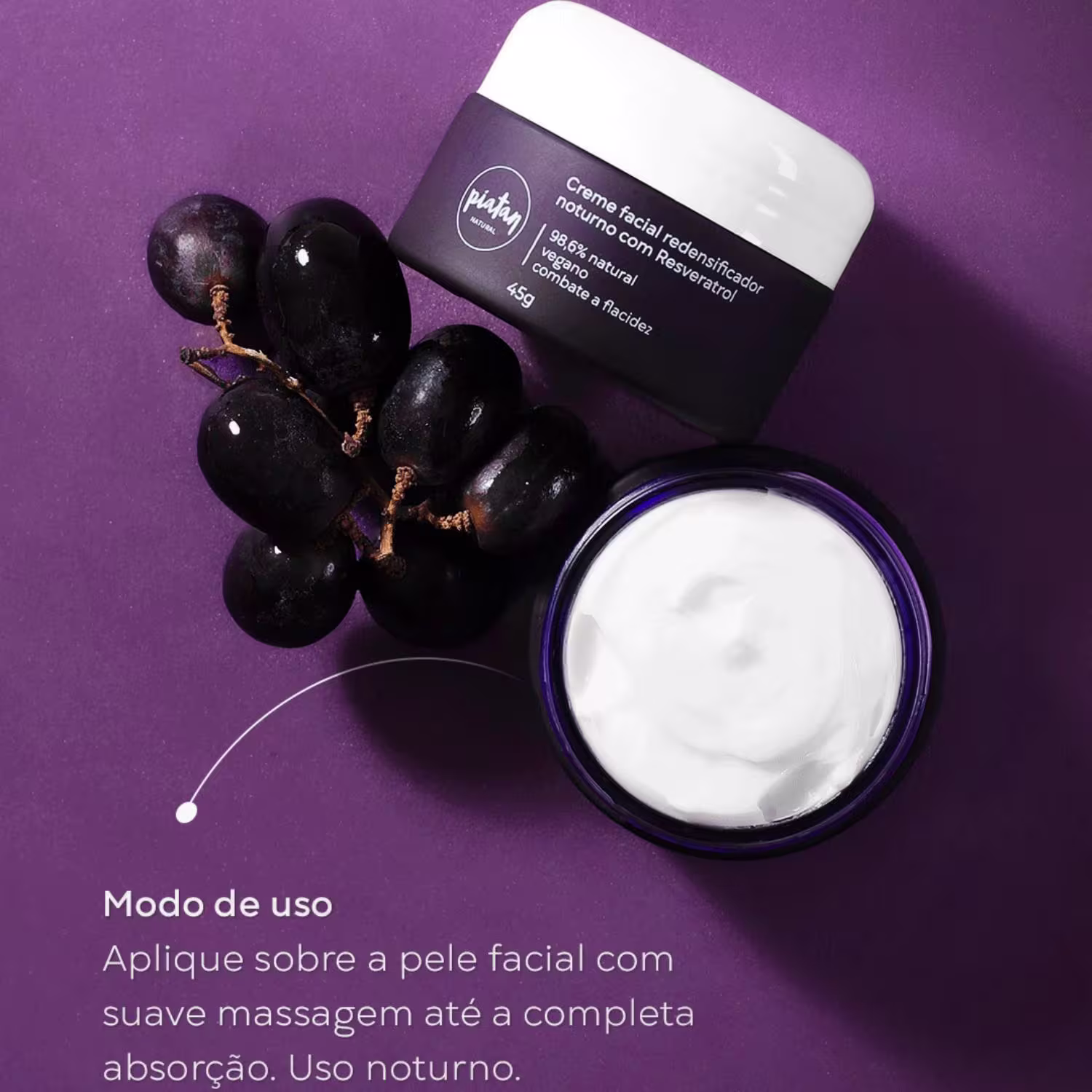 Imagem mostra duas embalagens do creme. Ao lado, um cacho de uvas pretas. Instruções de uso em português: "Aplique sobre a pele facial com suave massagem até a completa absorção. Uso noturno."