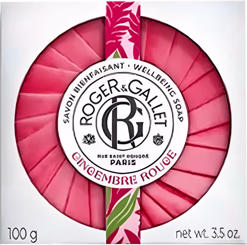 Barra de sabonete sólida da marca Roger & Gallet, com embalagem circular rosa e rótulo branco com logotipo da marca. Produto denominado "Gingembre Rouge" (Gengibre Vermelho), com peso líquido de 100g.