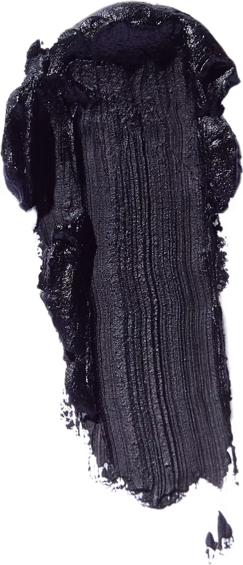 A imagem traz uma amostra de como é a textura e a tonalidade do produto. A imagem se assemelha a uma pincelada preta em um fundo branco.