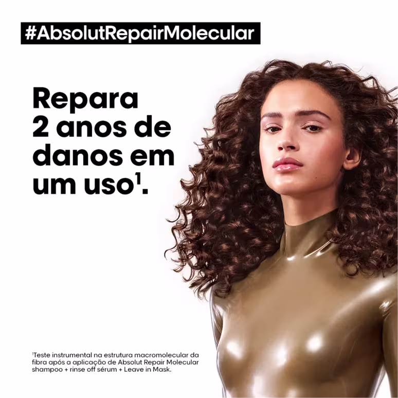 A imagem mostra uma mulher de cabelo castanho, cacheado e longo com a frase "repara 2 anos de danos em um uso".