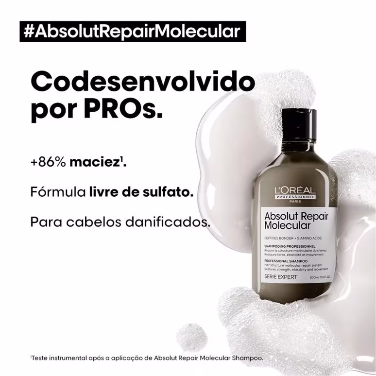 De um lado o shampoo e do doutro o texto: "Fórmula livre de sulfato" e "Para cabelos danificados". A garrafa está cercada por manchas brancas que parecem representar espuma ou vapor.