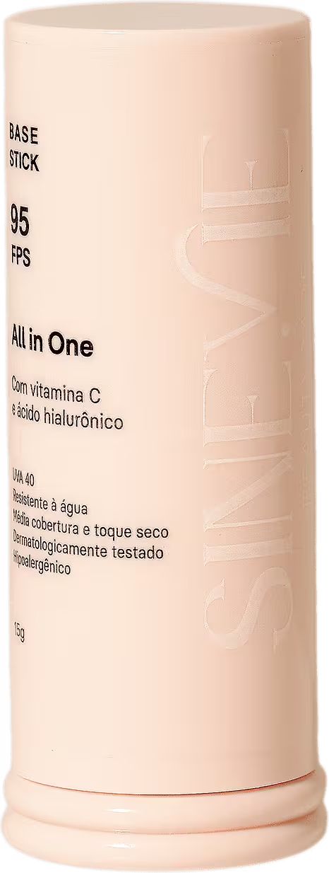 A imagem mostra um bastão de base facial cor bege com o logo da marca também em bege e informações sobre o produto em preto.