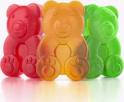 A imagem mostra 3 gomas, em formato de ursinho. Uma vermelha, uma laranja e uma verde.