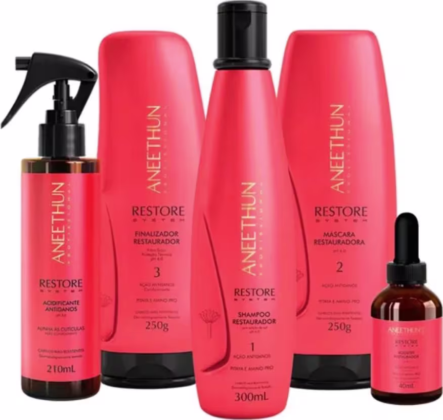 Os itens incluem um frasco spray de 210ml com o rótulo "Acidificante Antidanos", um shampoo 300ml, uma máscara de 250g, um finalizador 250g e um frasco âmbar conta-gotas de 60ml com o rótulo "Restore Booster".