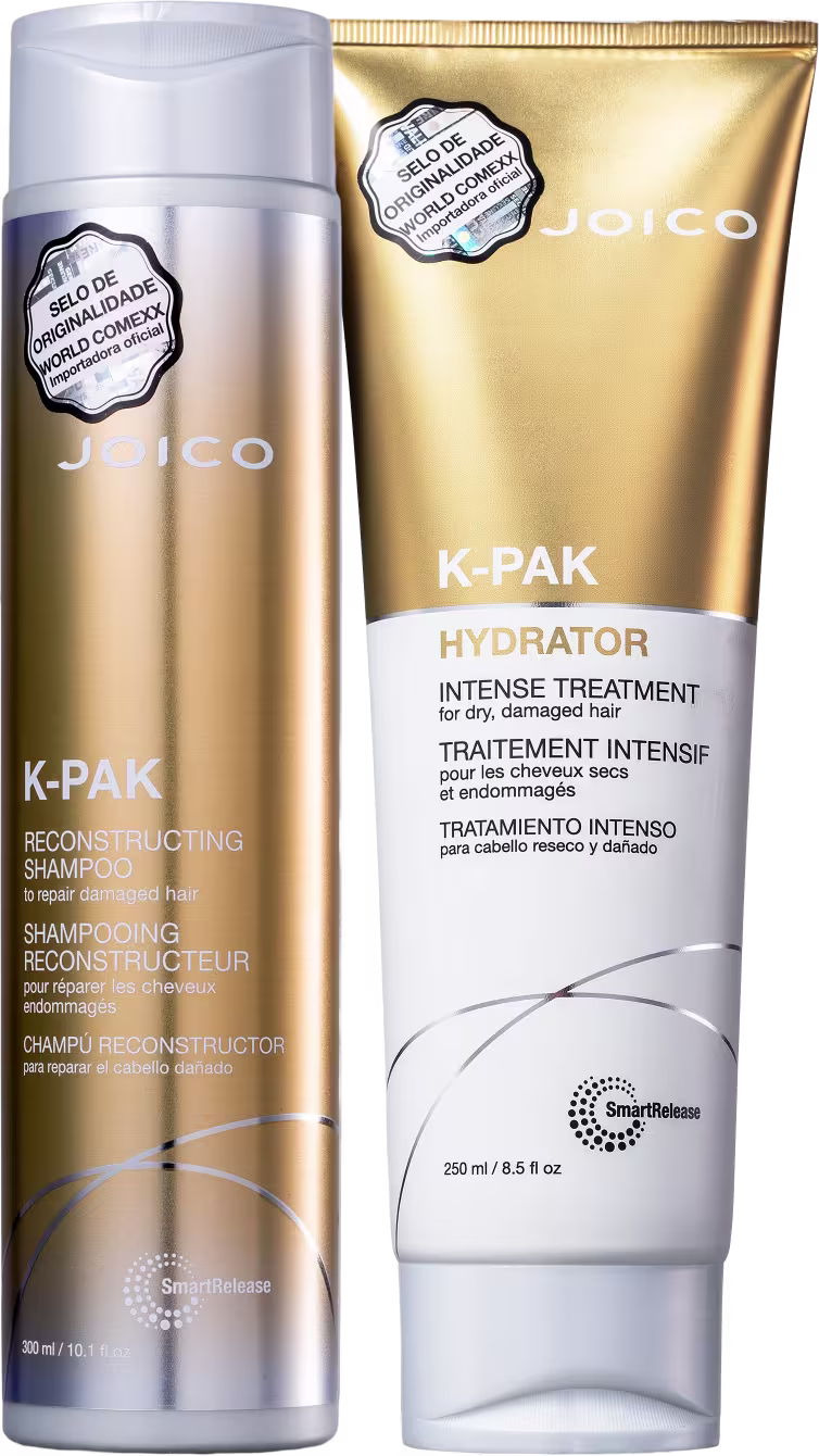 A imagem mostra o shampoo e a máscara capilar em embalagens com detalhes dourados. O shampoo possui um detalhe degradê na parte de cima e embaixo com detalhe prateado. Já a máscara capilar possui metade da embalagem dourada e o restante no tom branco.