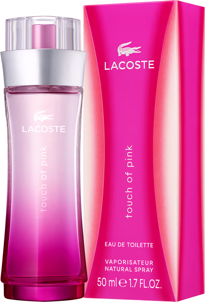Perfume em frasco cilíndrico transparente com gradiente de cores rosa e laranja. O frasco possui uma tampa plástica transparente. Na parte frontal do frasco, está impresso o logotipo "Lacoste" em letras maiúsculas brancas.