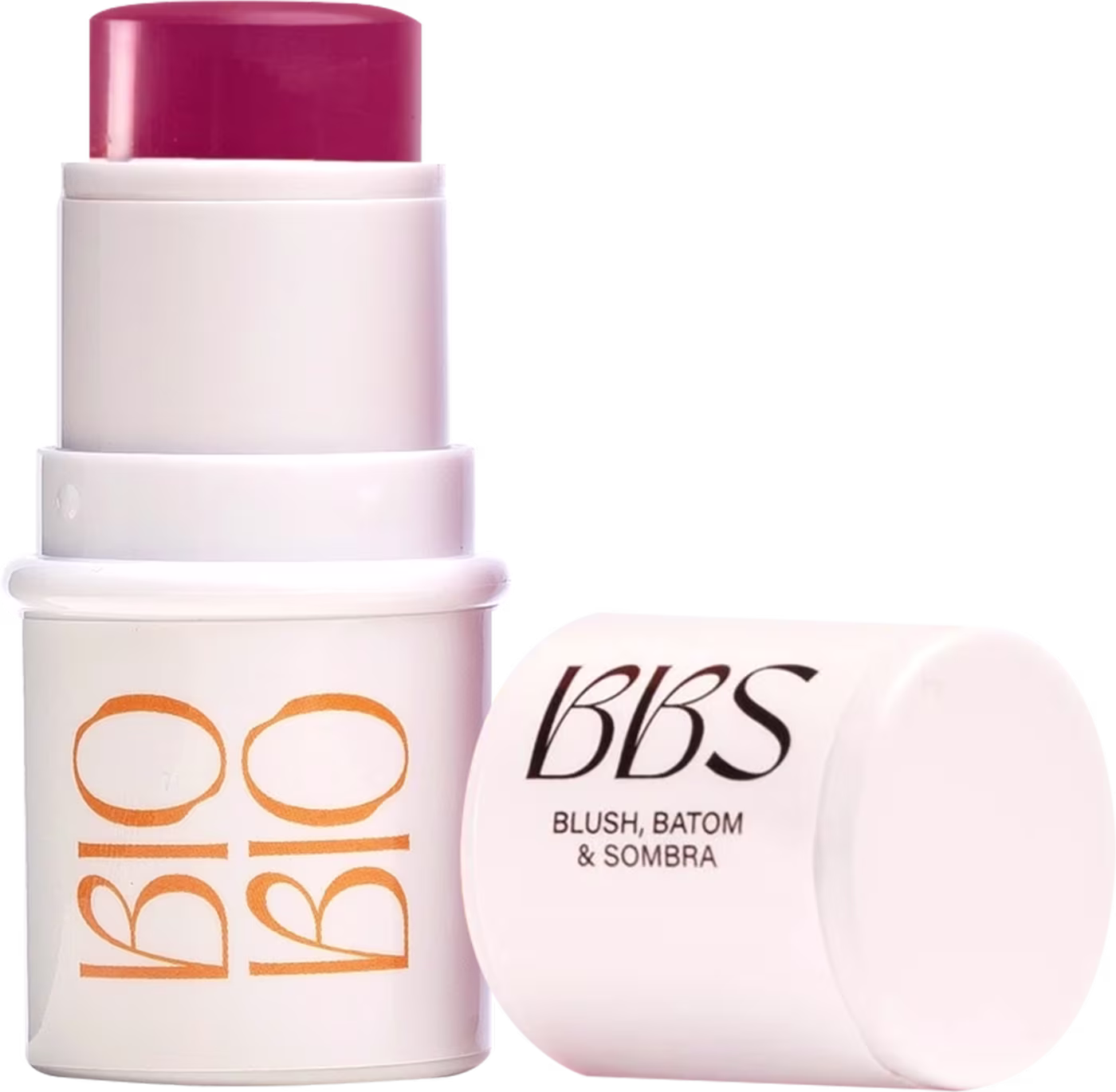 Produto de beleza em embalagem branca e rosa, com rótulo "BBS - Blush, Batom & Sombra". O produto possui formato de bastão, com tampa rosada na parte superior.