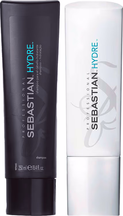 Dois produtos de cuidados capilares da marca Sebastian Professional: shampoo Hydre em um frasco cilíndrico preto com detalhes em azul. O outro é condicionador Hydre em embalagem branca cilíndrica com detalhes em azul.