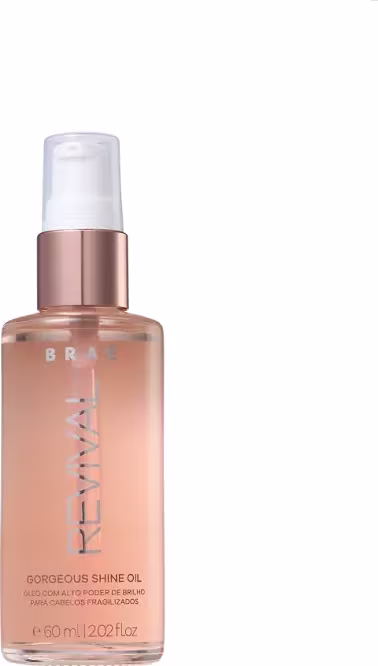 Óleo capilar Revival, da marca Braé. Frasco cilíndrico transparente, sendo possível identificar um líquido rosa em seu interior. Nome Revival impresso em letras prateadas, na superfície da embalagem.