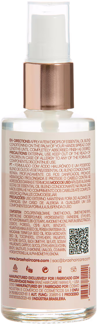 Produto de beleza em frasco plástico transparente com tampa rosada metálica. Embalagem com rótulo contendo texto descritivo em várias línguas, incluindo português, inglês e outros idiomas.