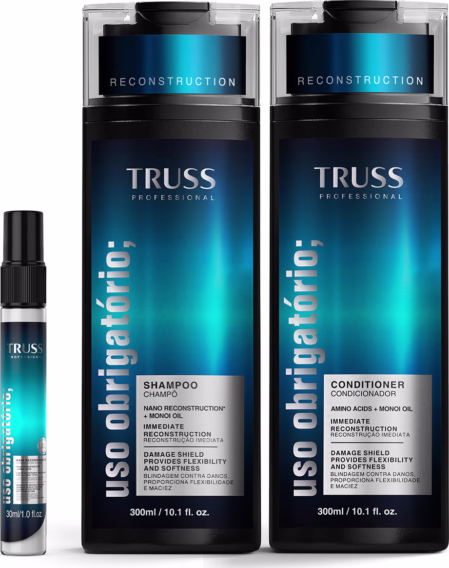 Dois frascos de shampoo e condicionador da linha Reconstruction da marca Truss Professional, com embalagens em tons de azul e preto, e um frasco menor de spray da mesma linha, em embalagem azul.