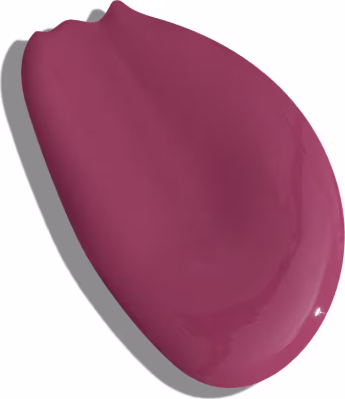 A imagem apresentada é a textura de um batom rosa queimado da marca Vult, num aspecto líquido e formato irregular. O batom em si não é visível.