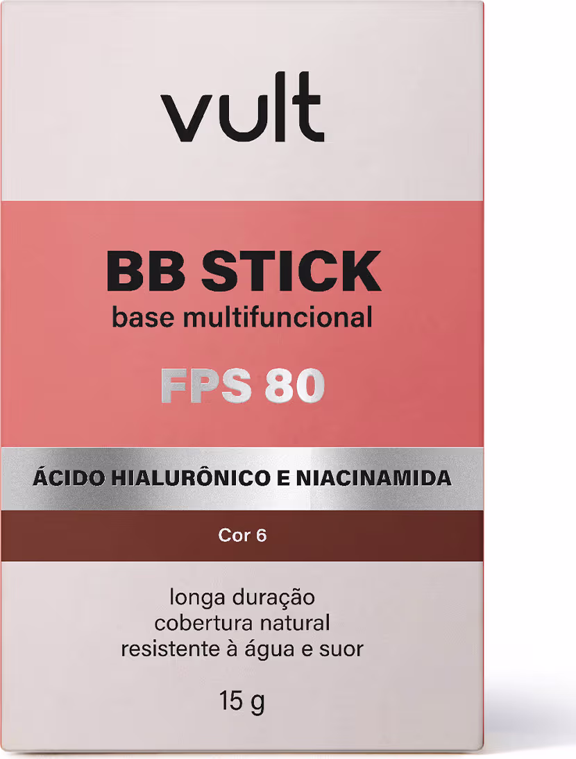 Caixa de BB Stick multifuncional da marca Vult, com FPS 80, contendo ácido hialurônico e niacinamida. Embalagem retangular com predominância das cores rosa e marrom, com informações sobre a composição e características do produto.