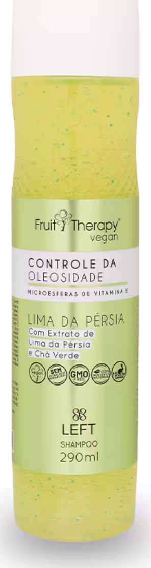 A imagem mostra um frasco transparente com rótulo amarelo e tampa branca de 290ml do shampoo da linha Fruit Therapy Vegan Lima da Pérsia, onde é possível ver o conteúdo amarelado por dentro. O design traz informações sobre benefícios e composição.