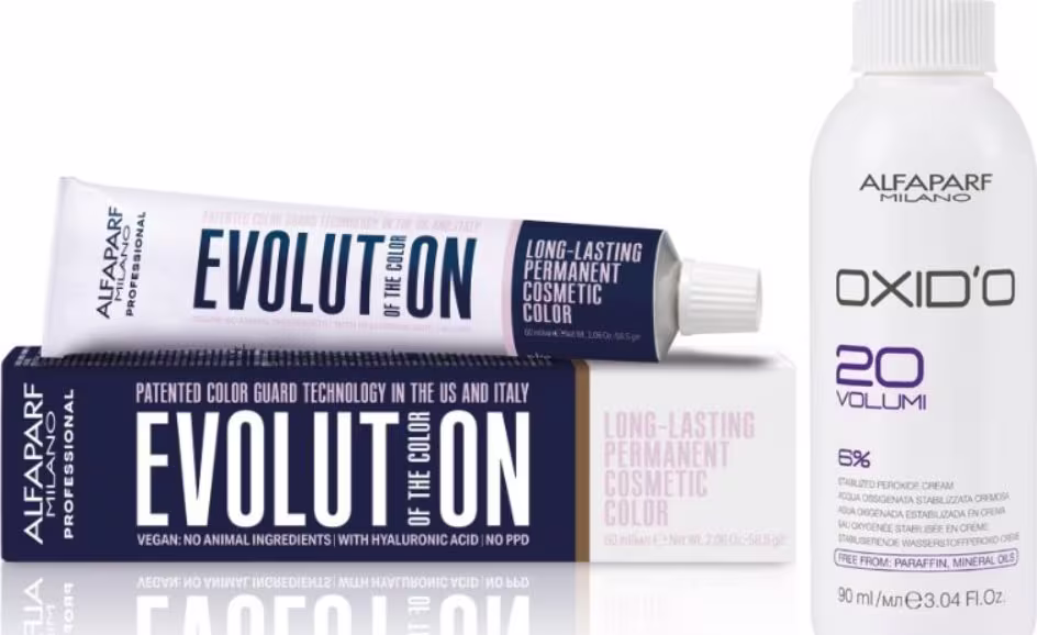 Embalagem de tinta de cabelo Alfaparf Milano Evolution, com tubo de creme colorante e frasco de oxidante, em cores predominantes branco e azul escuro. Rótulos indicam tratar-se de uma coloração permanente de longa duração.