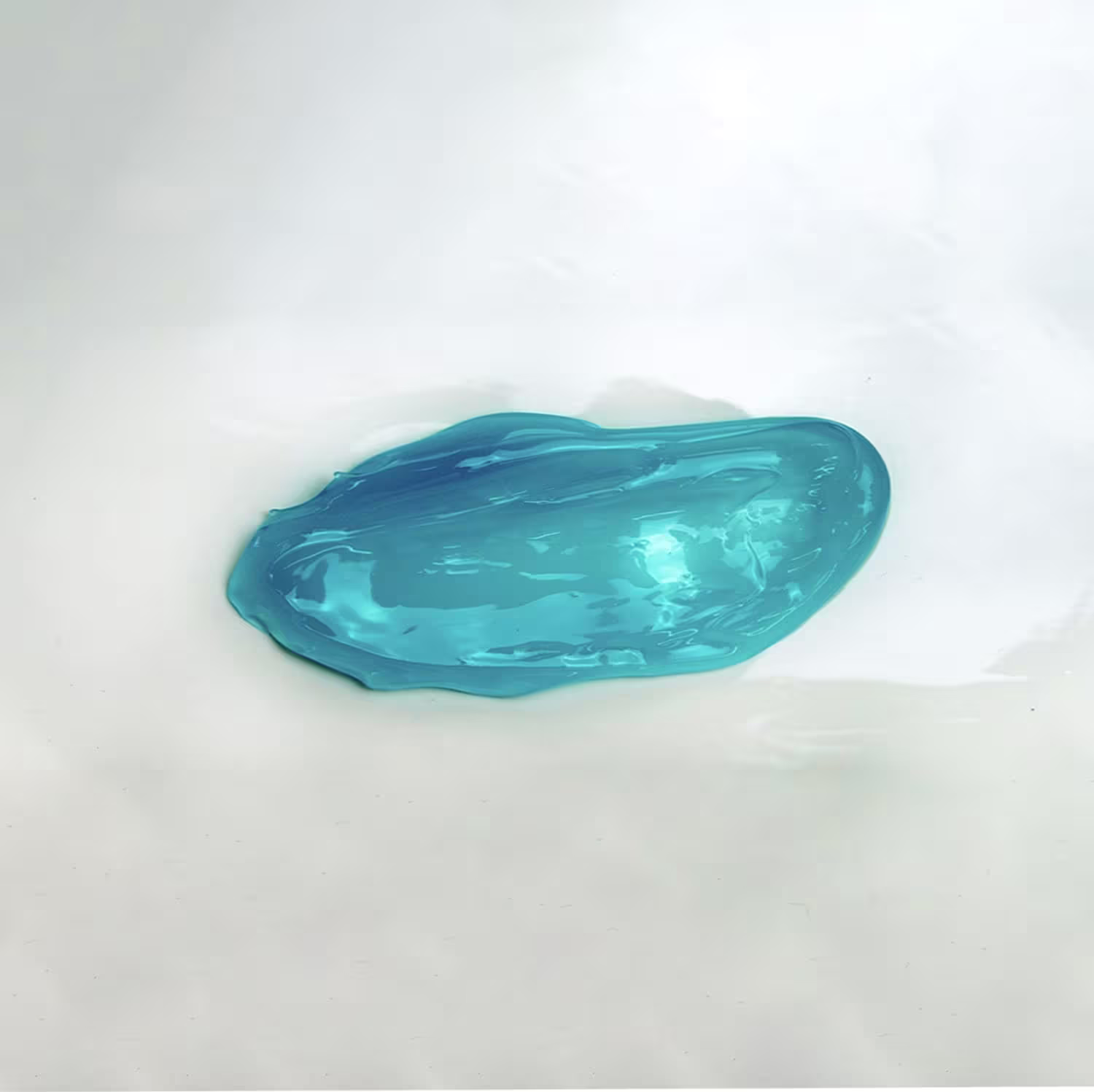 A textura do produto apresenta uma aparência viscosa e brilhante, com uma tonalidade azul-esverdeada predominante. Sua consistência parece ser cremosa e suave, sugerindo uma textura agradável ao toque.