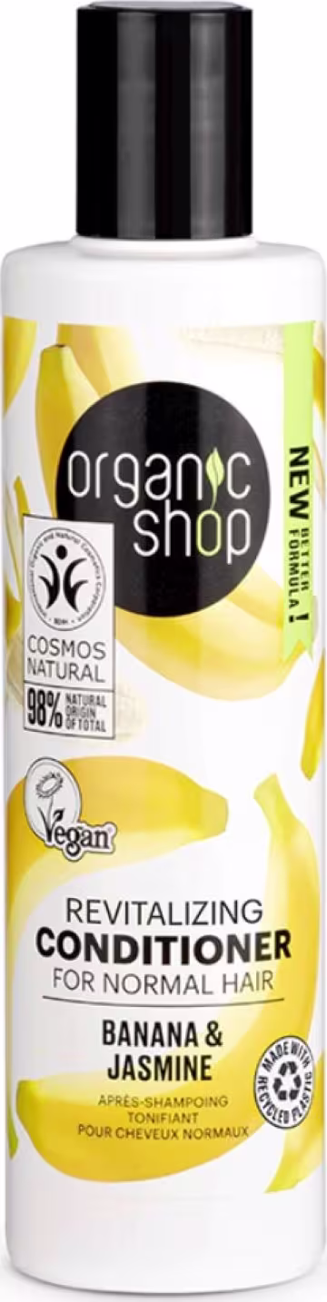 A imagem mostra o condicionador em embalagem plástica transparente com tampa preta. Rótulo branco com imagens de bananas e flores de jasmim em amarelo.