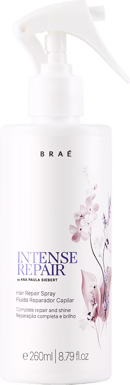 Frasco branco de spray para reparação intensa de cabelos, da marca Braé, com rótulo em tons de roxo e rosa, contendo 260ml do produto.