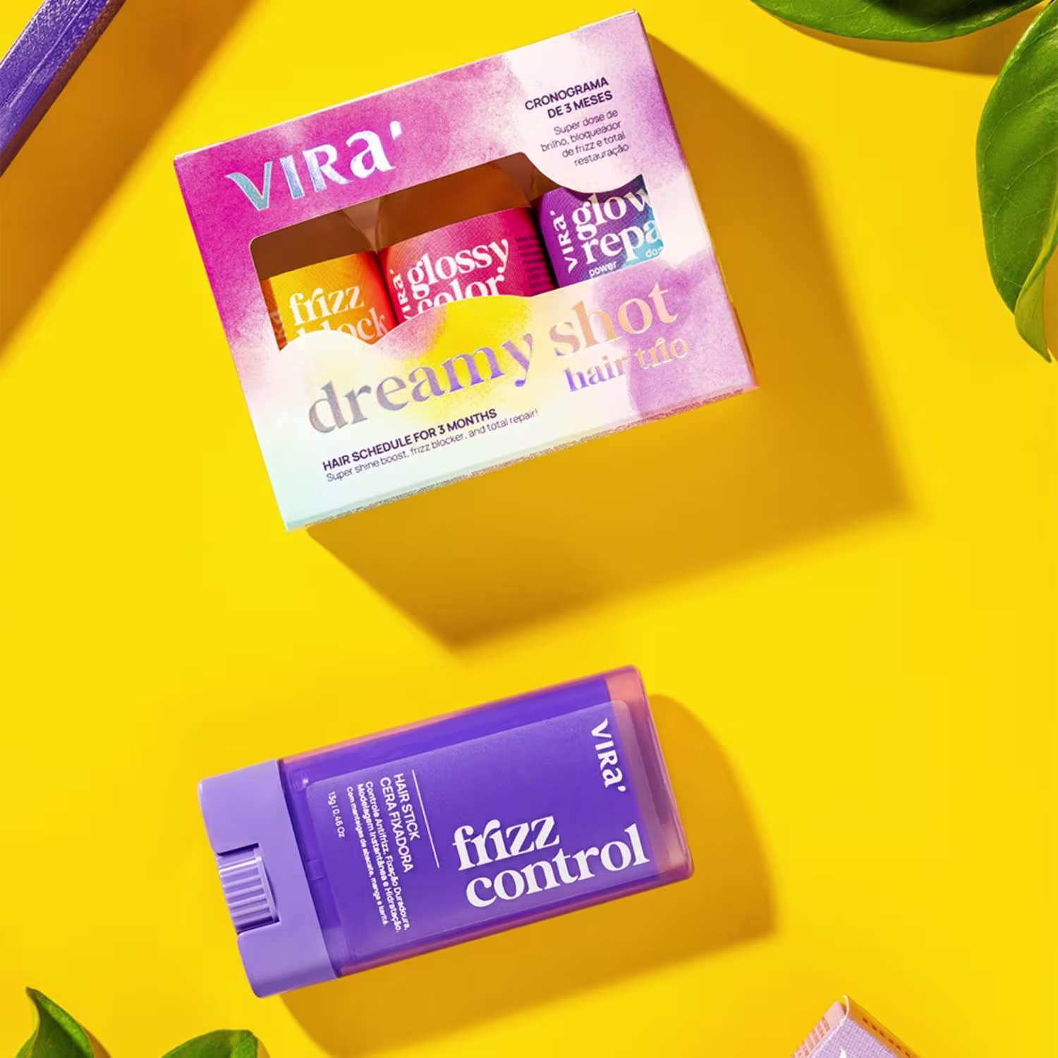 Caixa de produtos Virá Cosméticos contendo um frasco de Frizz Control e um kit com três produtos para tratamento capilar, incluindo Glossy Repara, Dreamy Shot e Frizz Lock, em embalagem com cores vibrantes de rosa, amarelo e roxo.