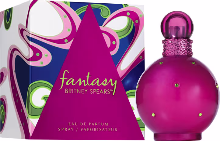 Perfume Fantasy da marca Britney Spears. Frasco de vidro arredondado na cor rosa vibrante com detalhes de strass. Caixa retangular com design abstrato em tons de rosa, azul e verde, exibindo o nome "Fantasy" e a marca Britney Spears em letras douradas.
