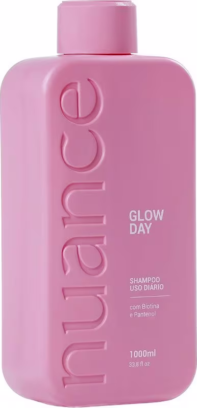 Shampoo Nuance Professional, com o nome "Glow Day" impresso no rótulo. A embalagem é um frasco plástico de cor rosa, com um design minimalista e uma tampa rosqueável no topo.
