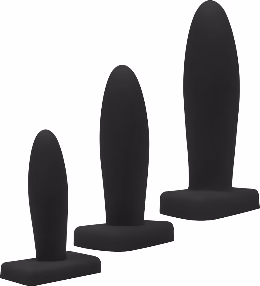 Três plugues anais pretos de diferentes tamanhos e formatos, com superfície lisa e uniforme, apresentados em fundo branco.