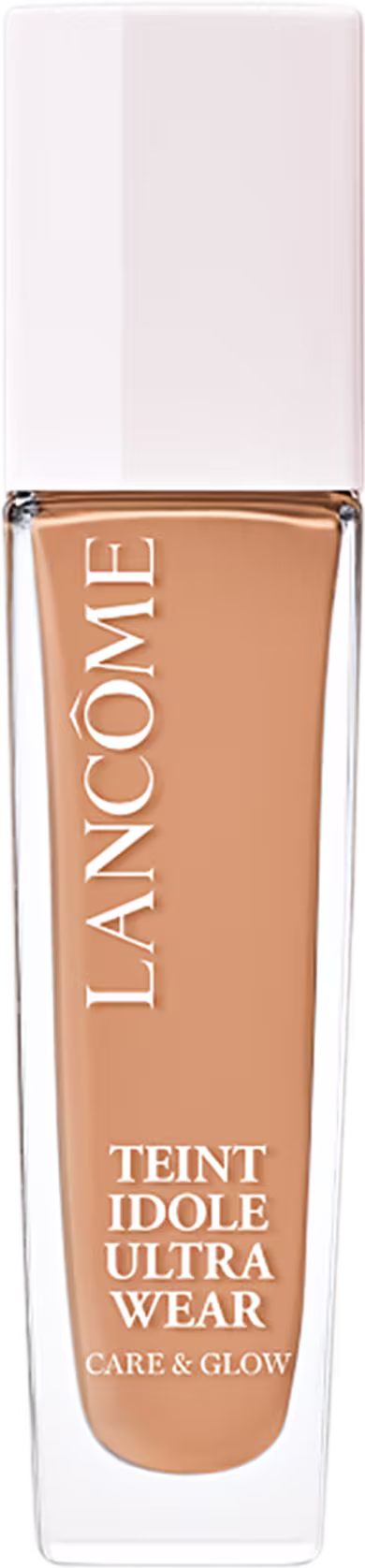 Frasco de maquiagem Lancôme Teint Idole Ultra Wear, com embalagem branca e detalhes dourados, contendo um produto de base líquida com acabamento natural e efeito de luminosidade.