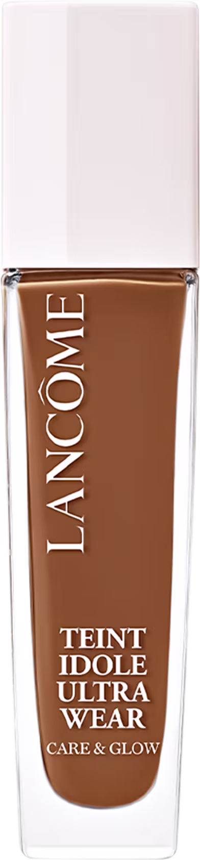 Frasco de maquiagem Lancôme Teint Idole Ultra Wear, com embalagem branca e tampa dourada. O rótulo destaca o nome do produto e suas características de "Care & Glow".