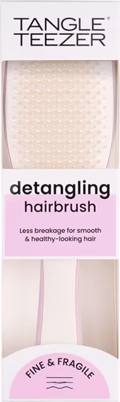 Escova de Cabelo Tangle Teezer. Embalagem plástica transparente com moldura branca. Rótulo na parte superior com o nome do produto em letras maiúsculas pretas. Descrição em letras menores.