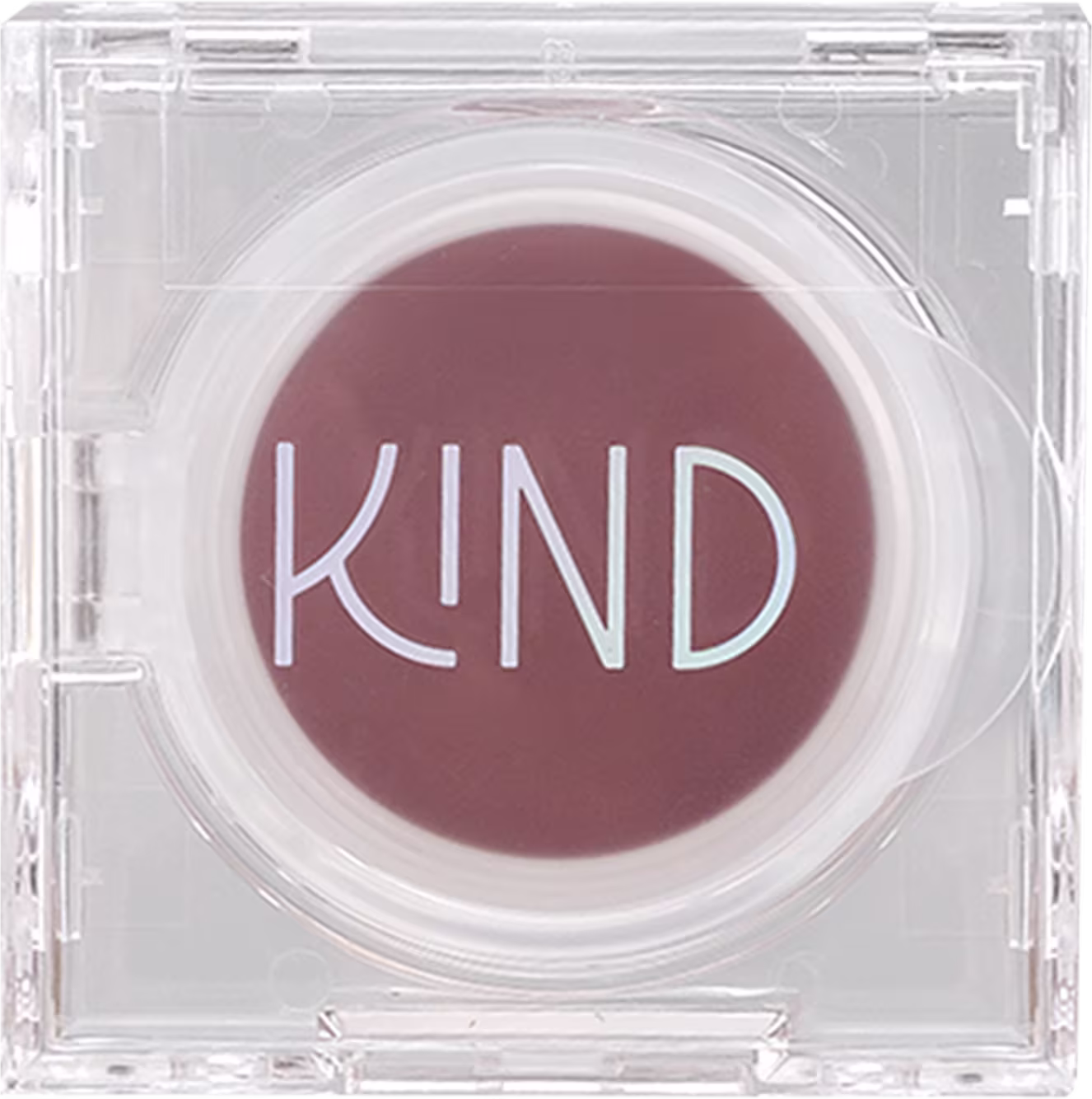 A imagem mostra a embalagem fechada de um blush marrom. Em formato redondo, o produto fica dentro de uma caixinha de acrílico transparente. A caixa está fechada e na parte superior, tem o nome da marca em destaque.