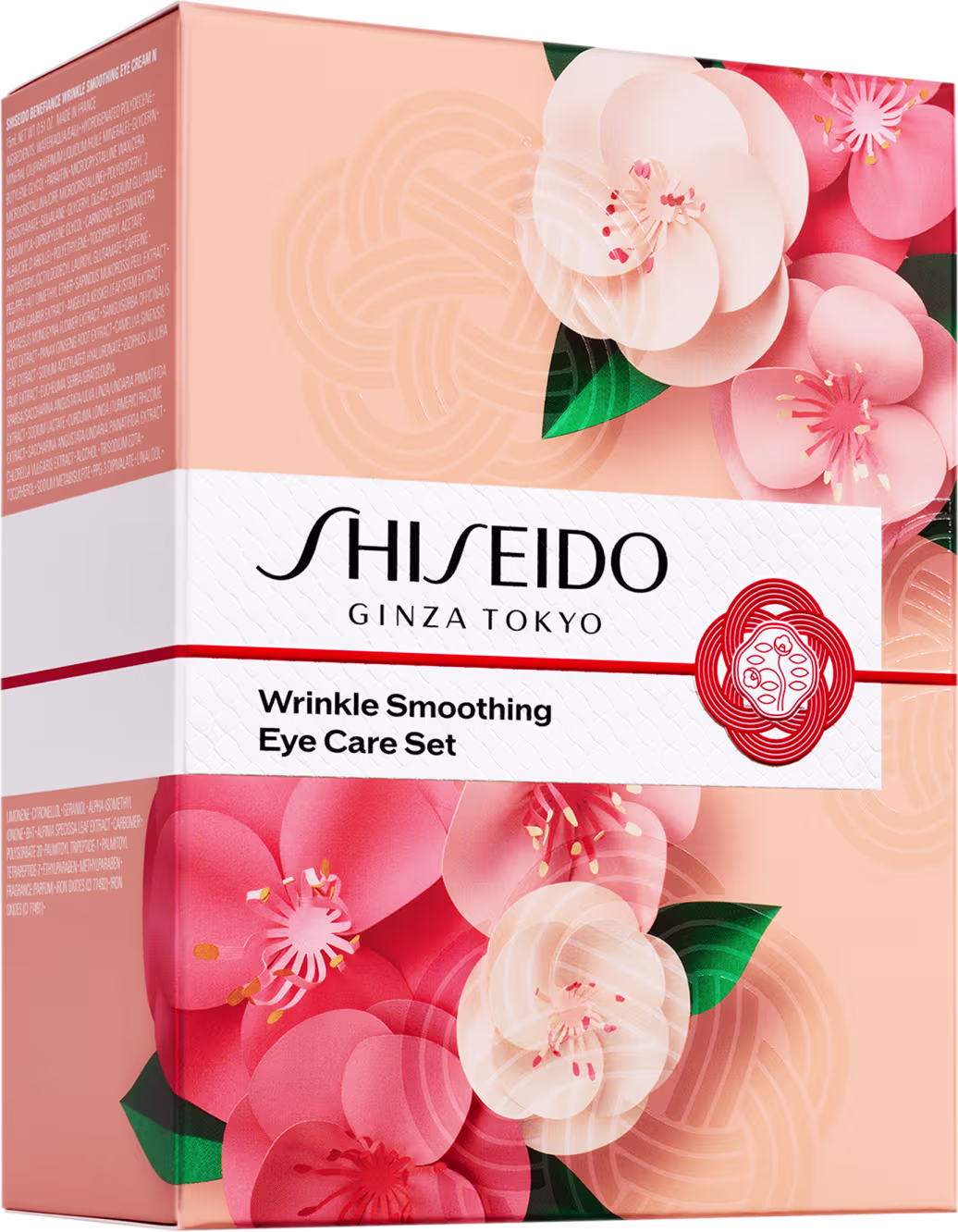 Conjunto de cuidados para os olhos da marca Shiseido. A embalagem é uma caixa retangular de cor pêssego com detalhes brancos e vermelhos. A frente da caixa apresenta uma grande imagem de flores de cerejeira rosa e branca com folhas verdes.