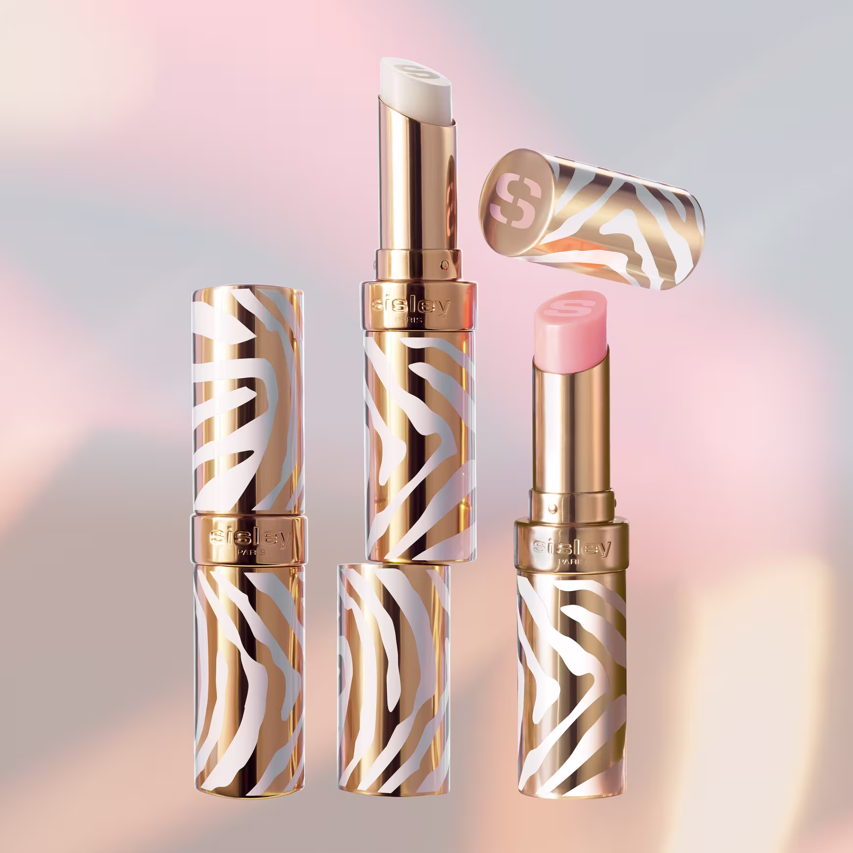 Três embalagens do bálsamo labial