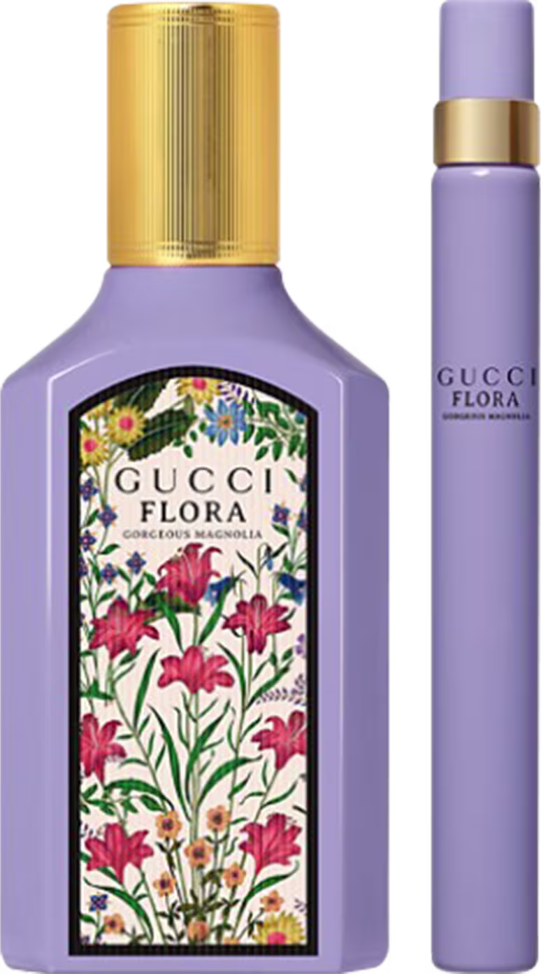 A imagem mostra um frasco de perfume azul com rótulo de flores e tampa dourada e uma versão travel size toda azul com detalhe dourado.