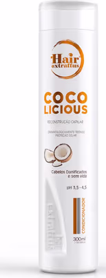 Frasco branco de 300ml da linha Hair Extrattus, com rótulo laranja e texto "Coco licious" destacado. Produto para cabelos, com informações sobre propriedades de hidratação e proteção solar.