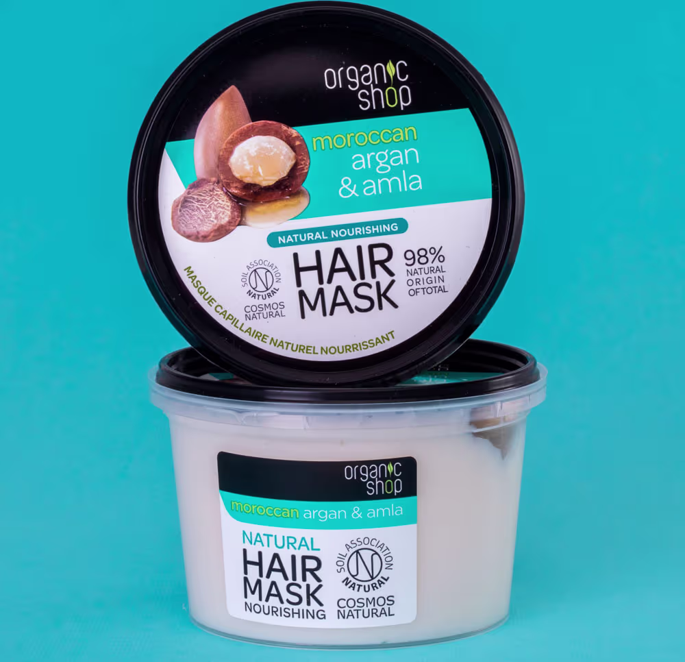 A imagem mostra duas embalagens da máscara capilar em um fundo azul turquesa.